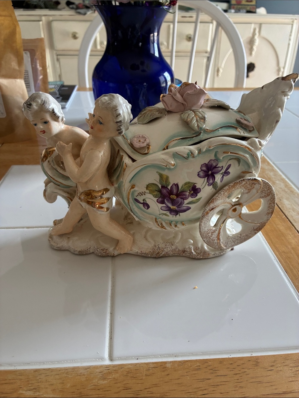 Hand-Painted Porcelain Cherub Cart Figurine with Purple Floral Detail